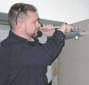 Employee Fixing Door Hinge, Herndon, VA, Spencer's Safe & Lock