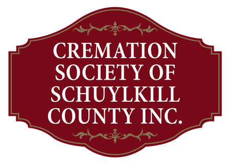 A red sign that says cremation society of schuylkill county inc.