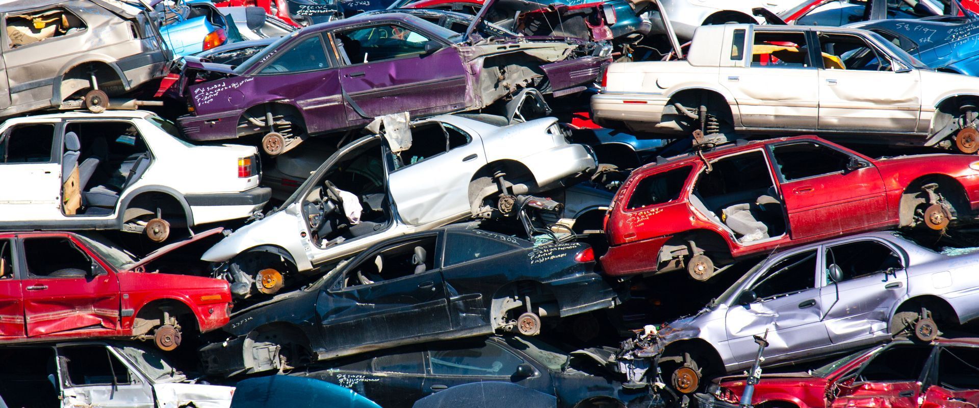 A bunch of cars are stacked on top of each other