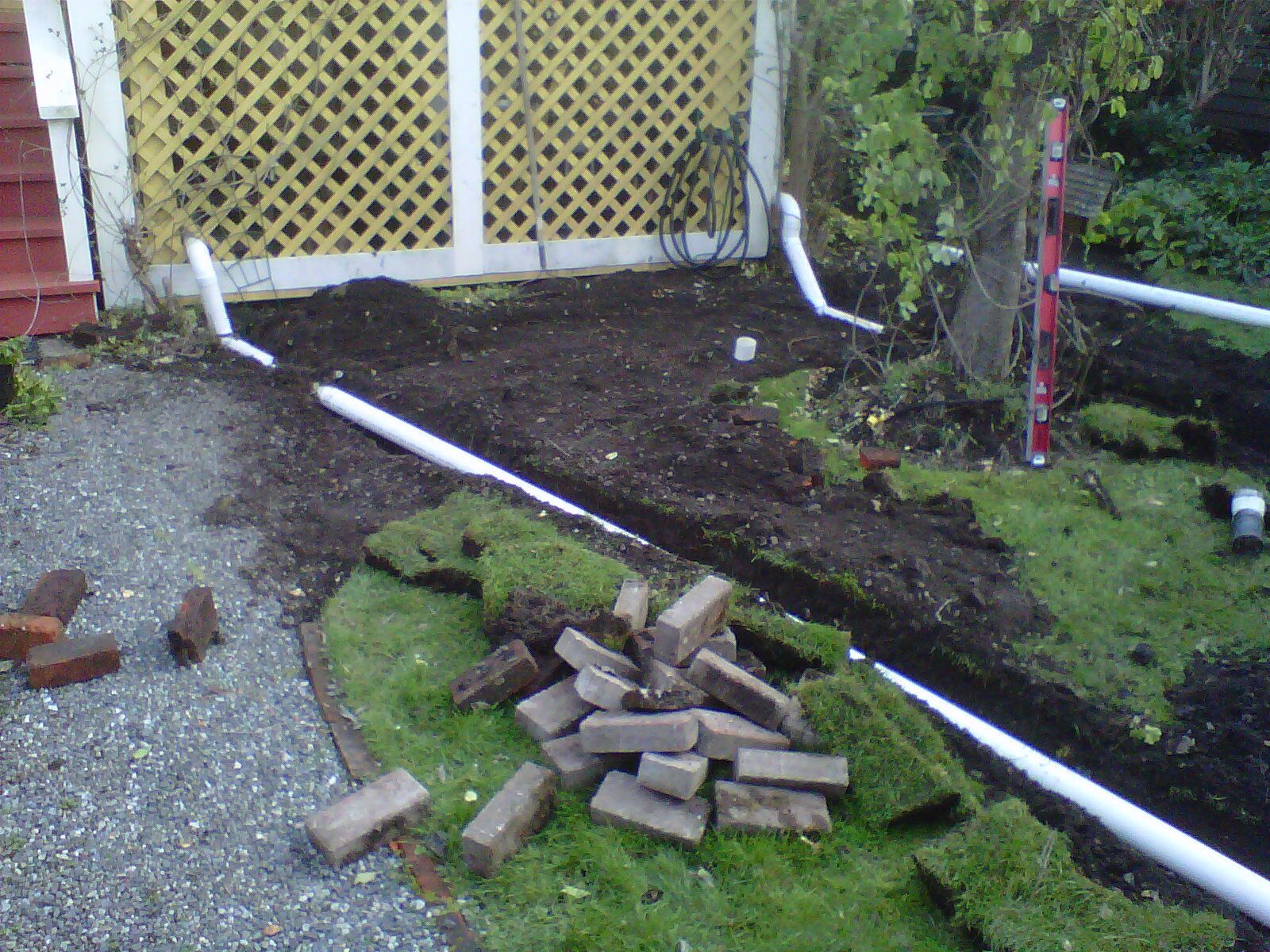 Yard drainage system being installed