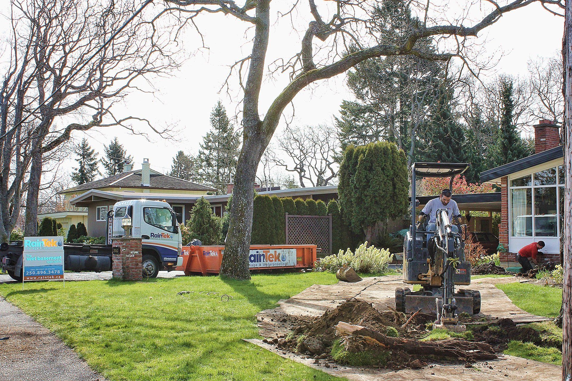 image showing RainTek workers installing anew drain system for a residential home in Victoria BC