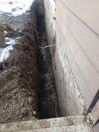 Protecting a foundation by replacing perimeter drainage (drain tile)