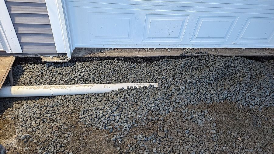 Channel drain installation for driveway