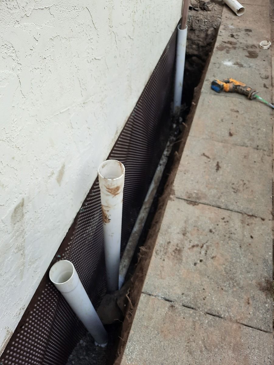 Foundation drainage system with waterproofing membrane to protect exterior concrete foundation