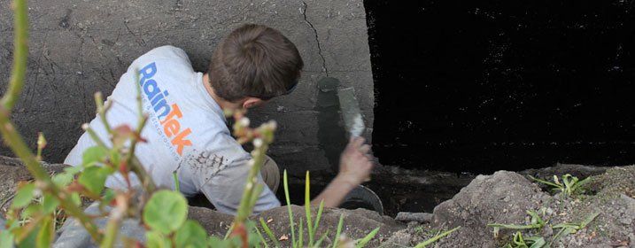An image of a RainTek worker repairing a crack in a concrete foundation before waterproofing it to protect it against further cracks and leaks