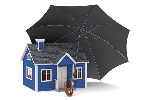 An image of an umbrella over a house to illustrate the peace of mind a waterproofed basement can provide for homeowners