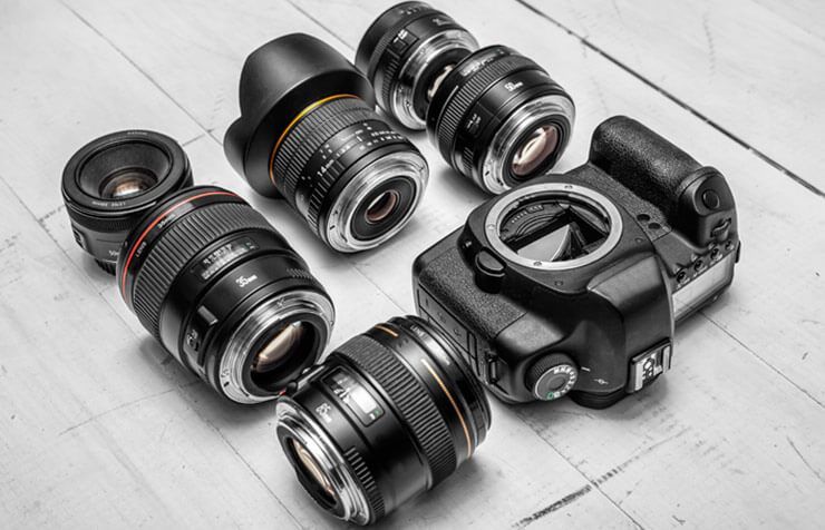 Camera Lenses and Camera on table