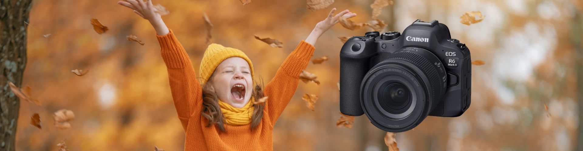 A little girl is standing in front of a camera with her arms in the air.