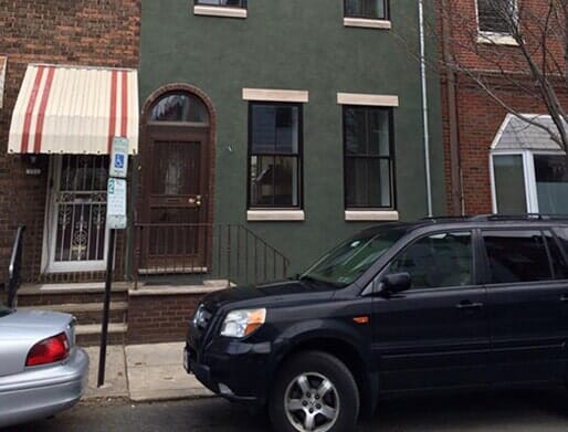 Man Plastering a Wall — Structural Damage in Philadelphia, PA