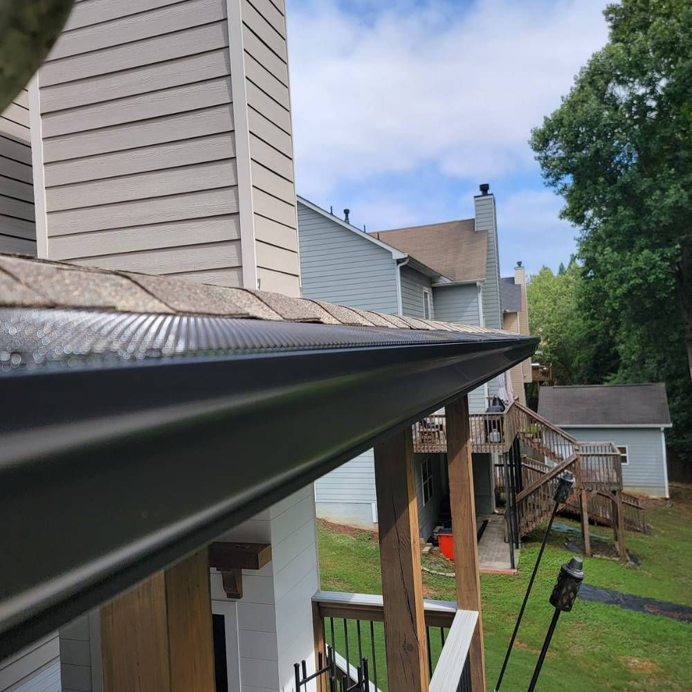 A house with a gutter on the side of it