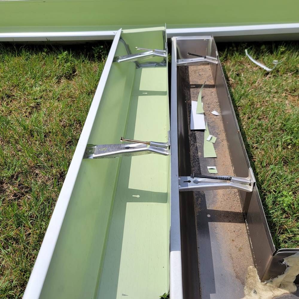 A green and white planter sitting on top of a lush green field