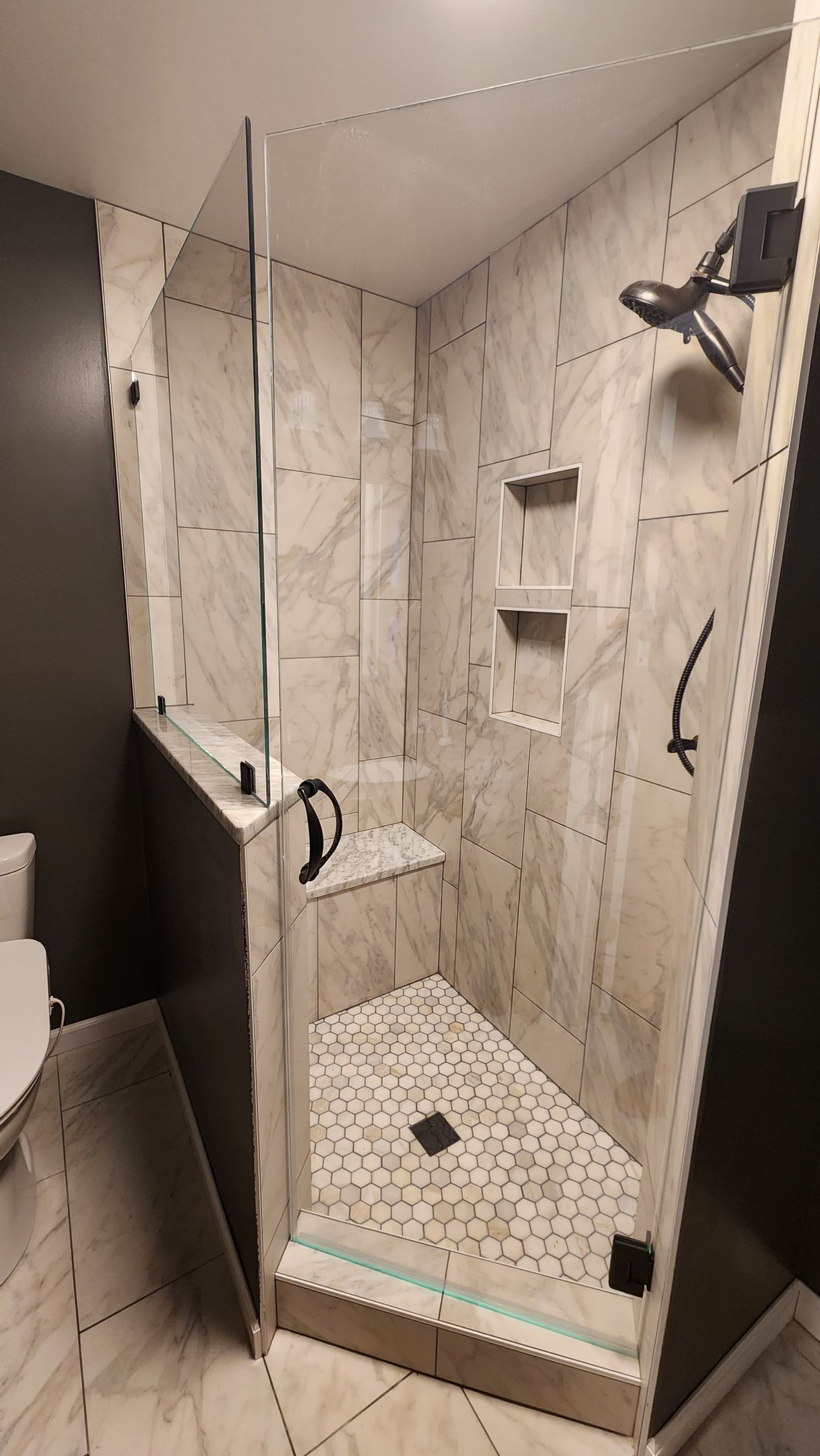 A bathroom with a bathtub , sink , shower and blue walls. A bathroom with a bathtub , sink , shower and blue walls.