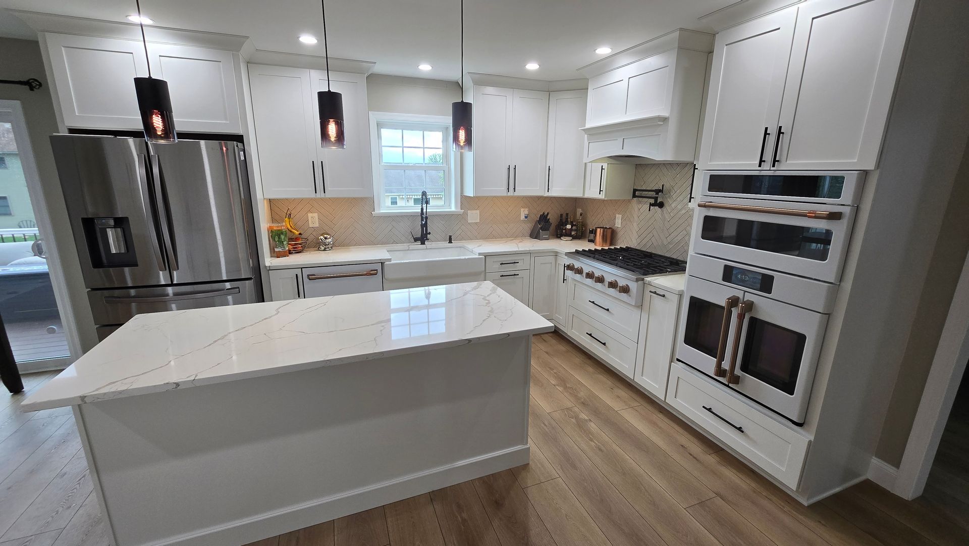 A laundry room with a washer and dryer and a sink