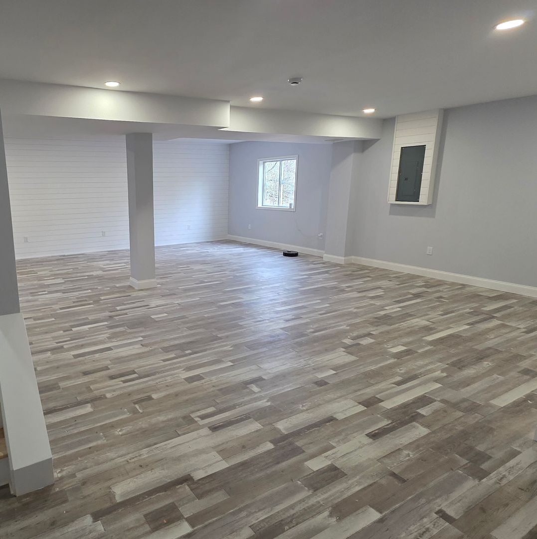 There is a stone fireplace in the middle of the room. There is a stone fireplace in the middle of the room.