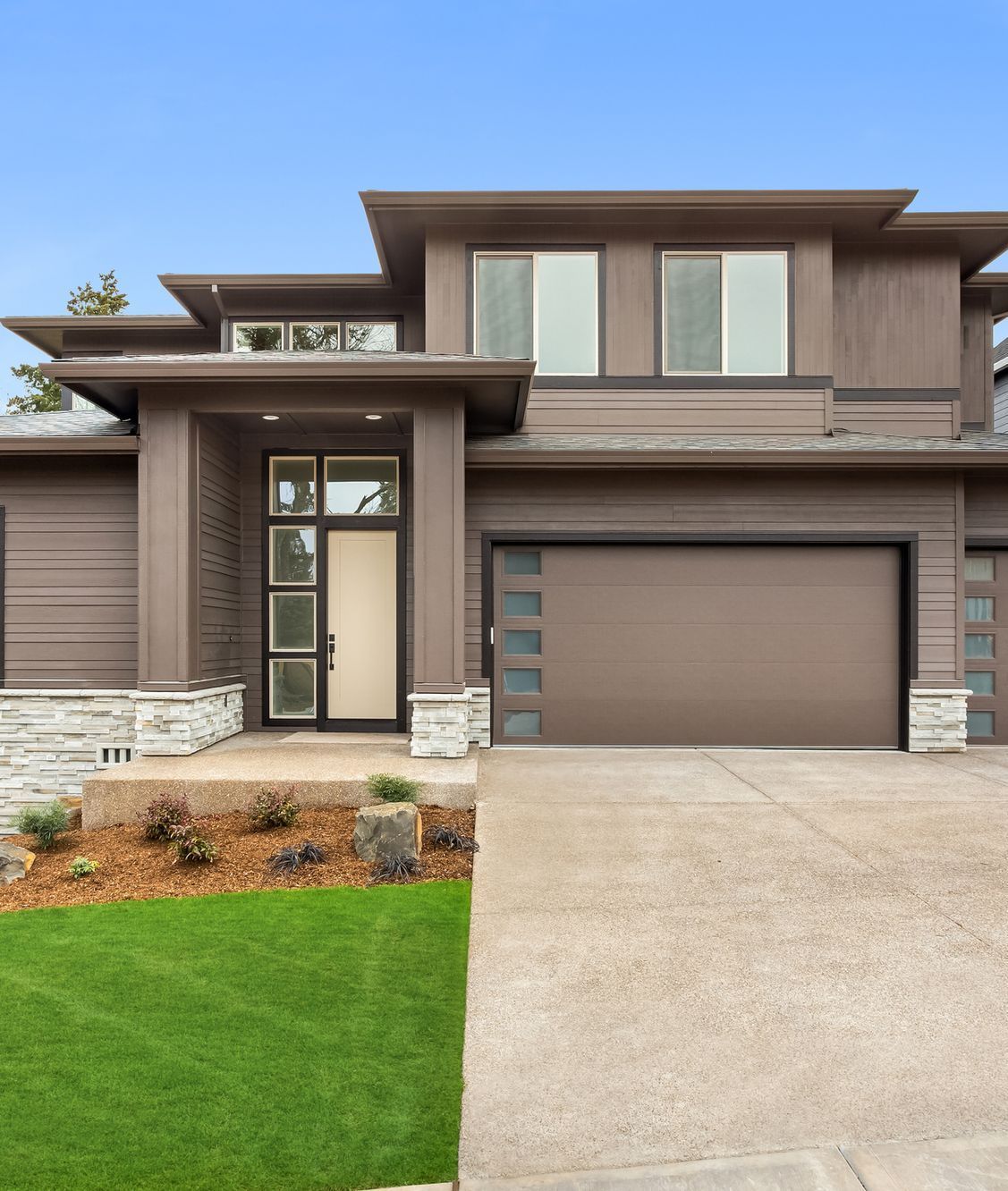A large house is being built in a residential area.