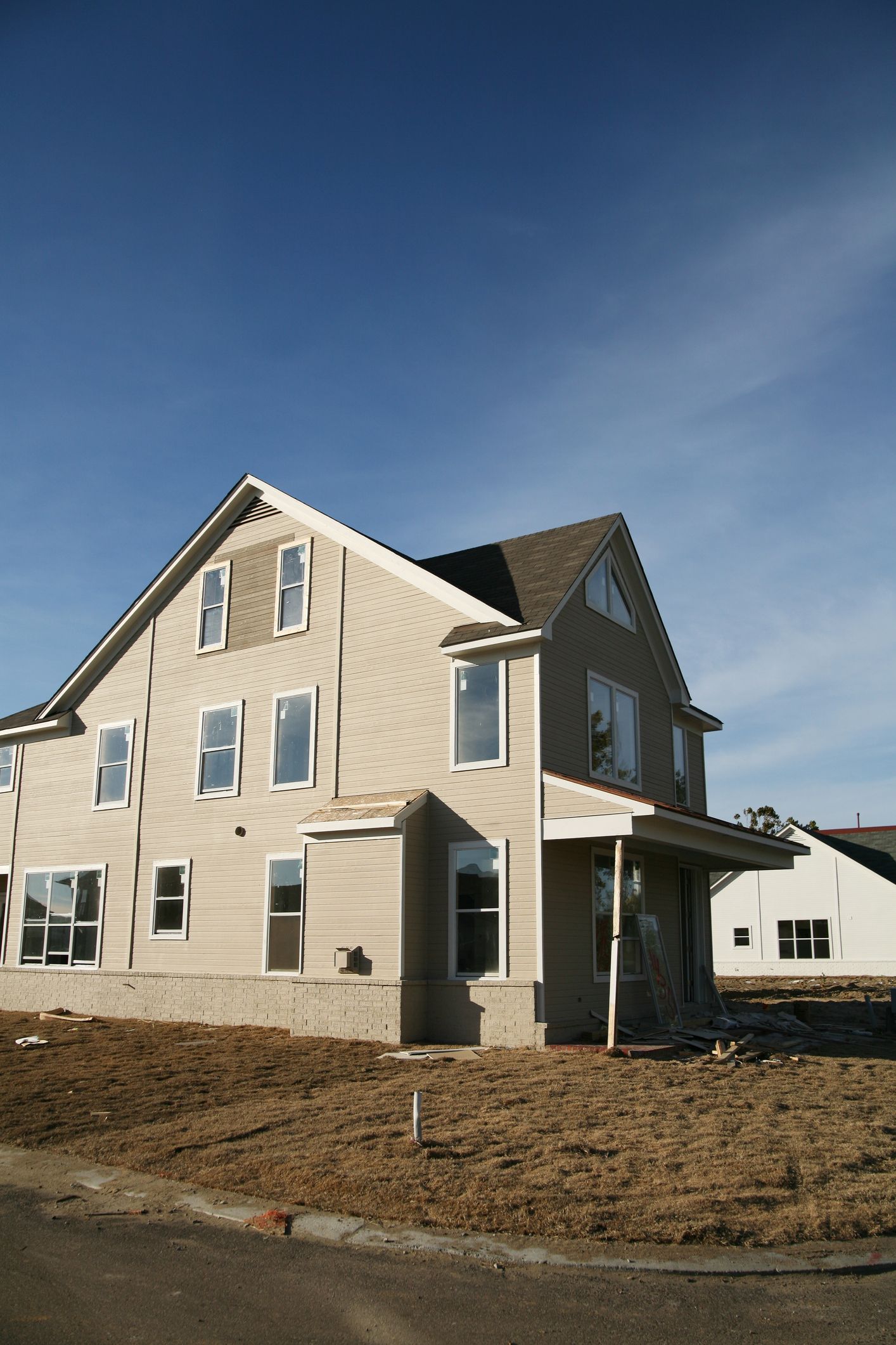 A large house is being built in a residential area. A large house is being built in a residential area.