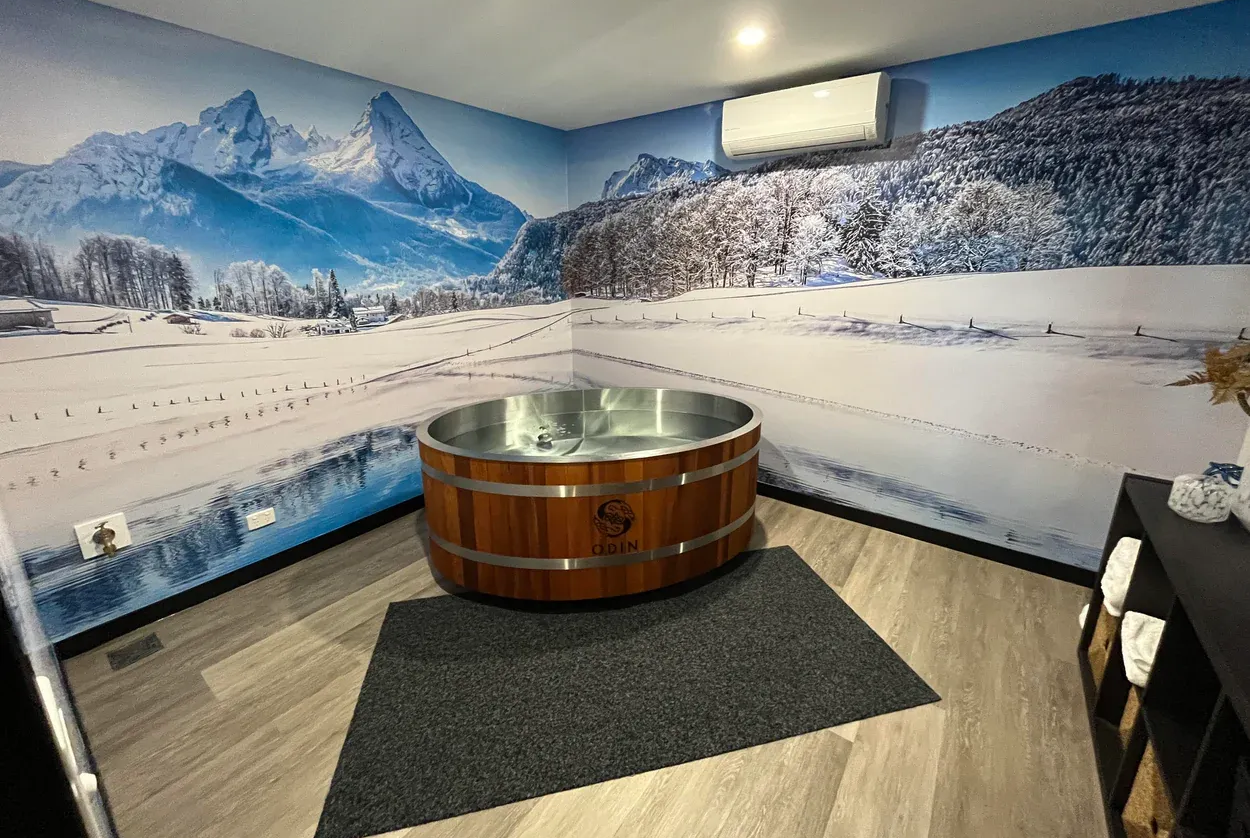 There is a wooden tub in the middle of the room.