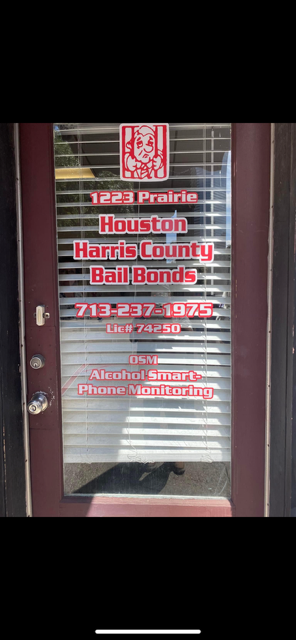 A door with a sign on it that says harris county bail bonds