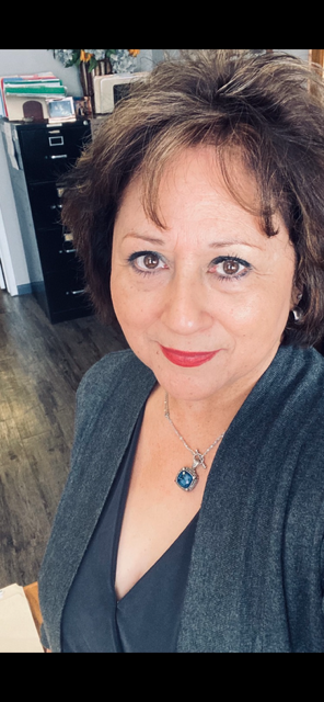 A woman is taking a selfie in a room.