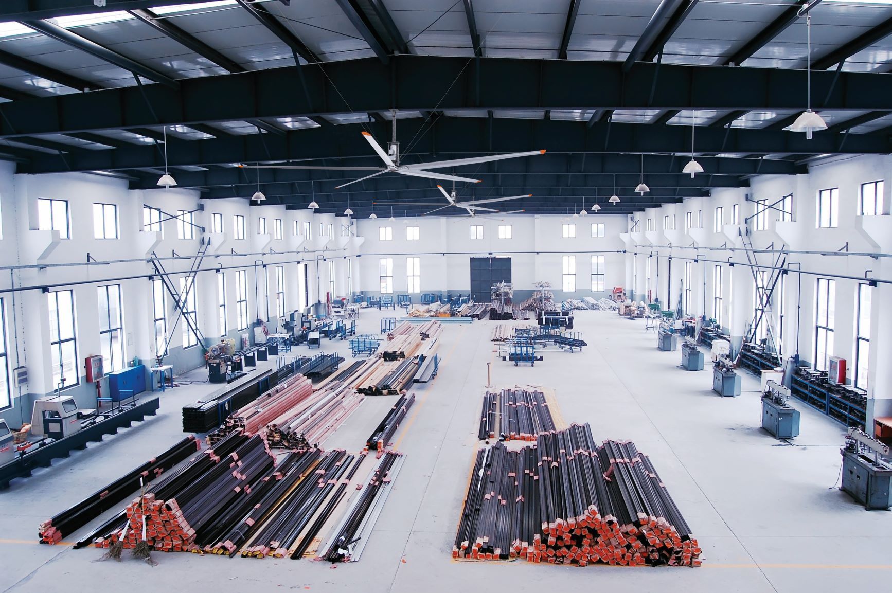 A large warehouse filled with lots of pieces of metal