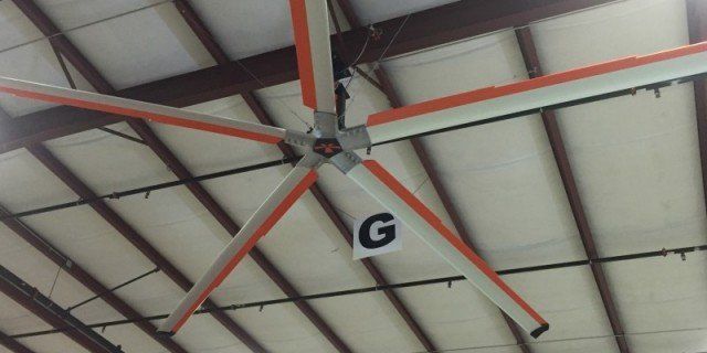 A large ceiling fan with the letter g on it