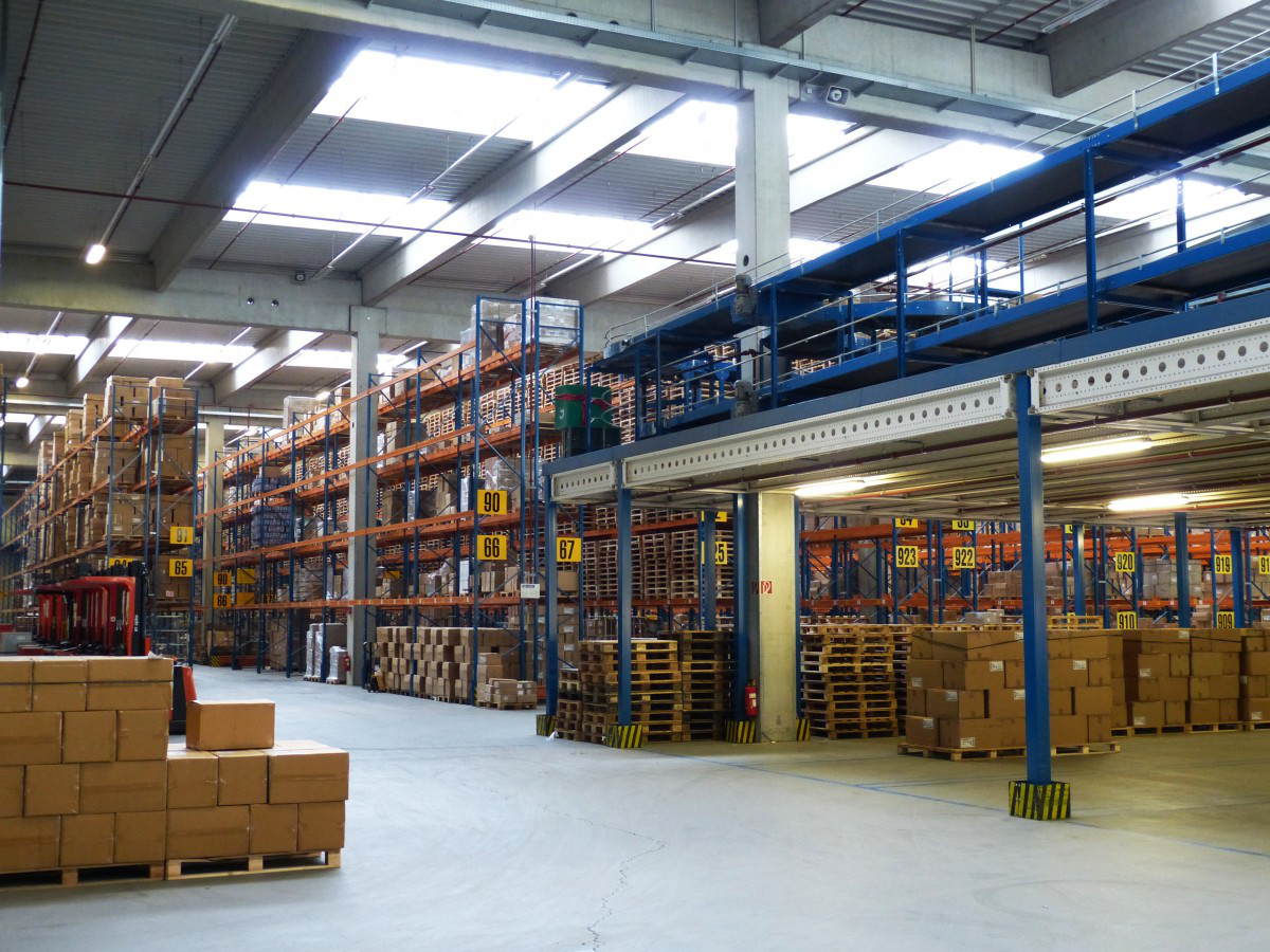 A large warehouse filled with lots of boxes and shelves.