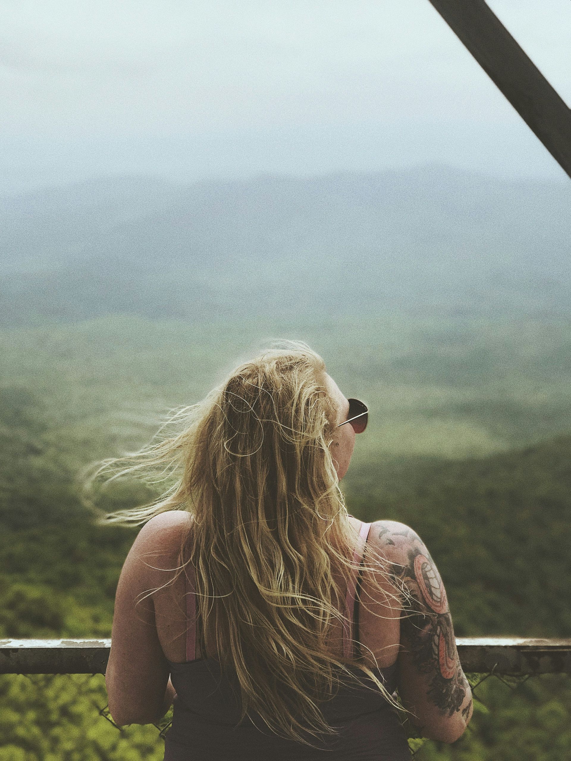 A young man is helping an older man with his medication.