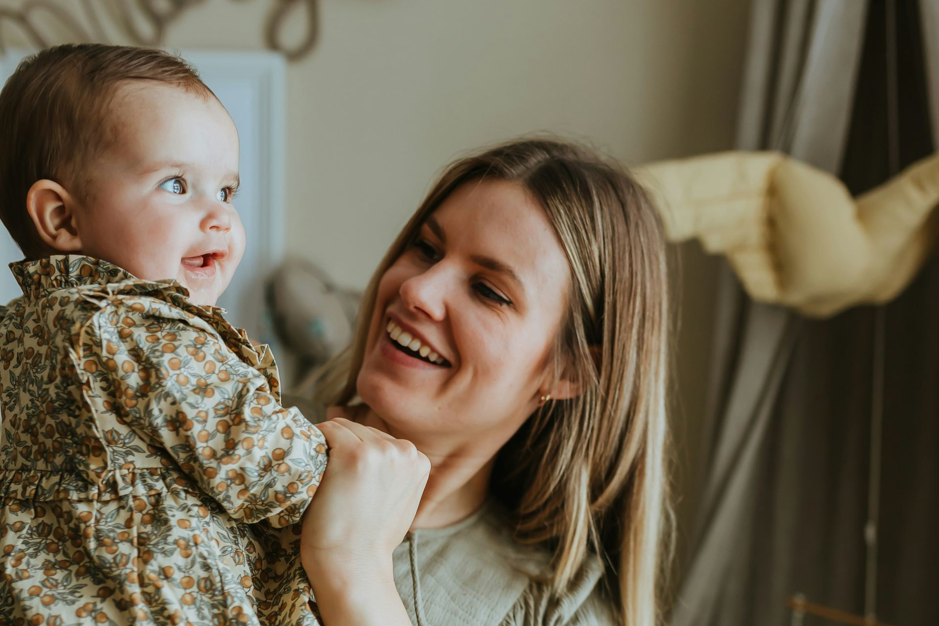 Two bowls of pills and a blister pack of pills on a green table.