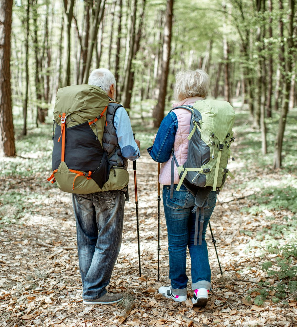 A young man is helping an older man with his medication.
