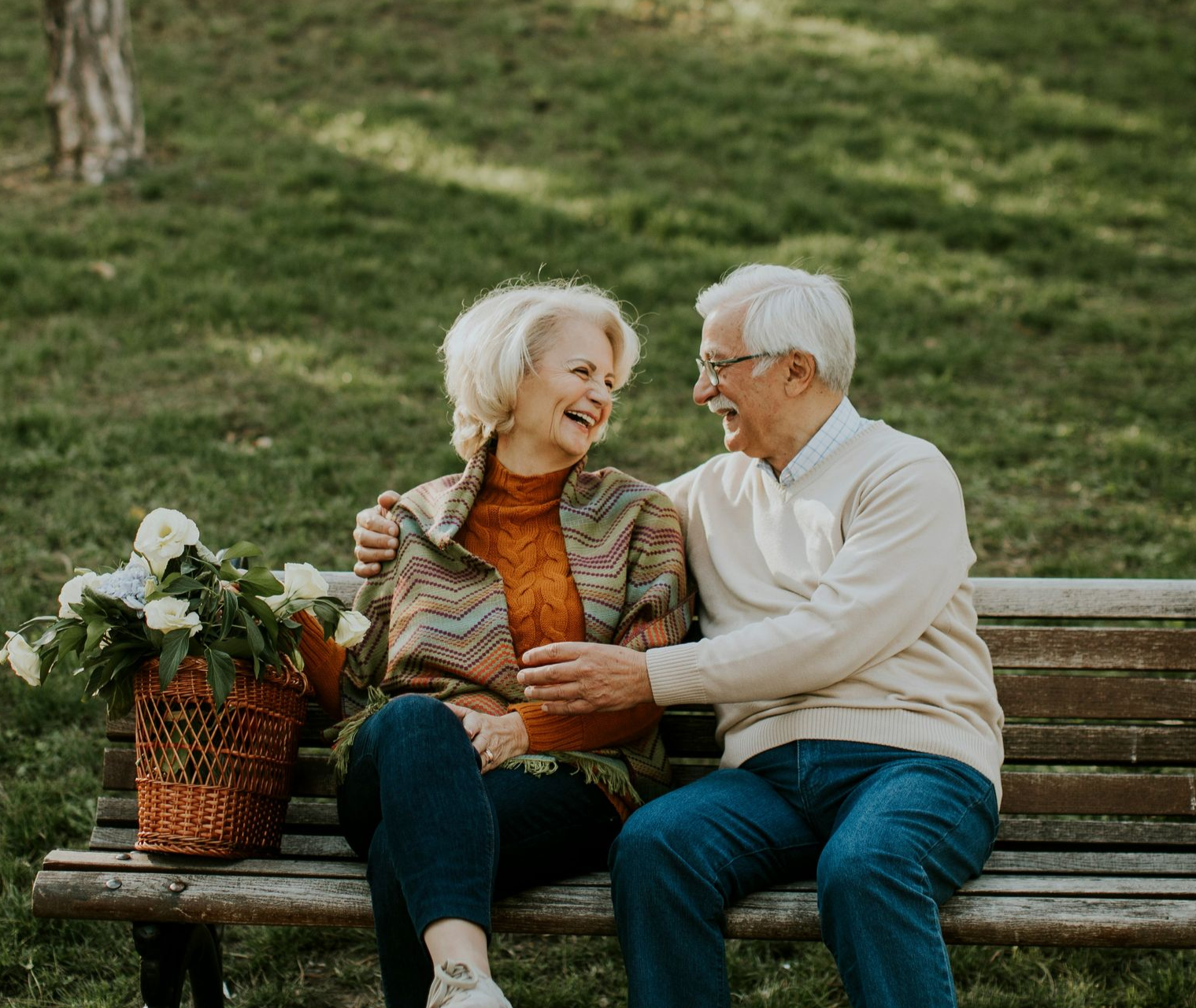 A young man is helping an older man with his medication.