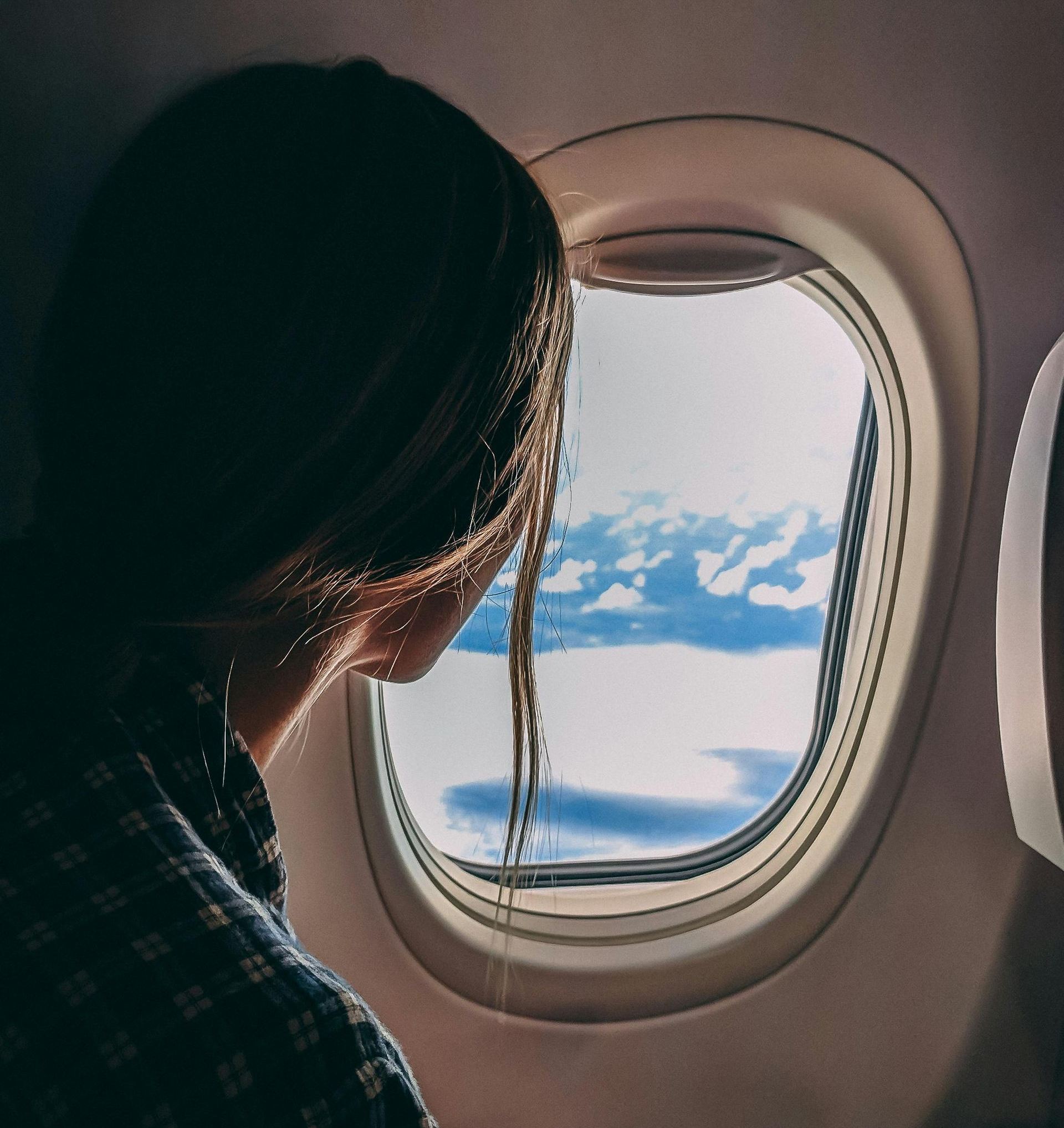 A young man is helping an older man with his medication.