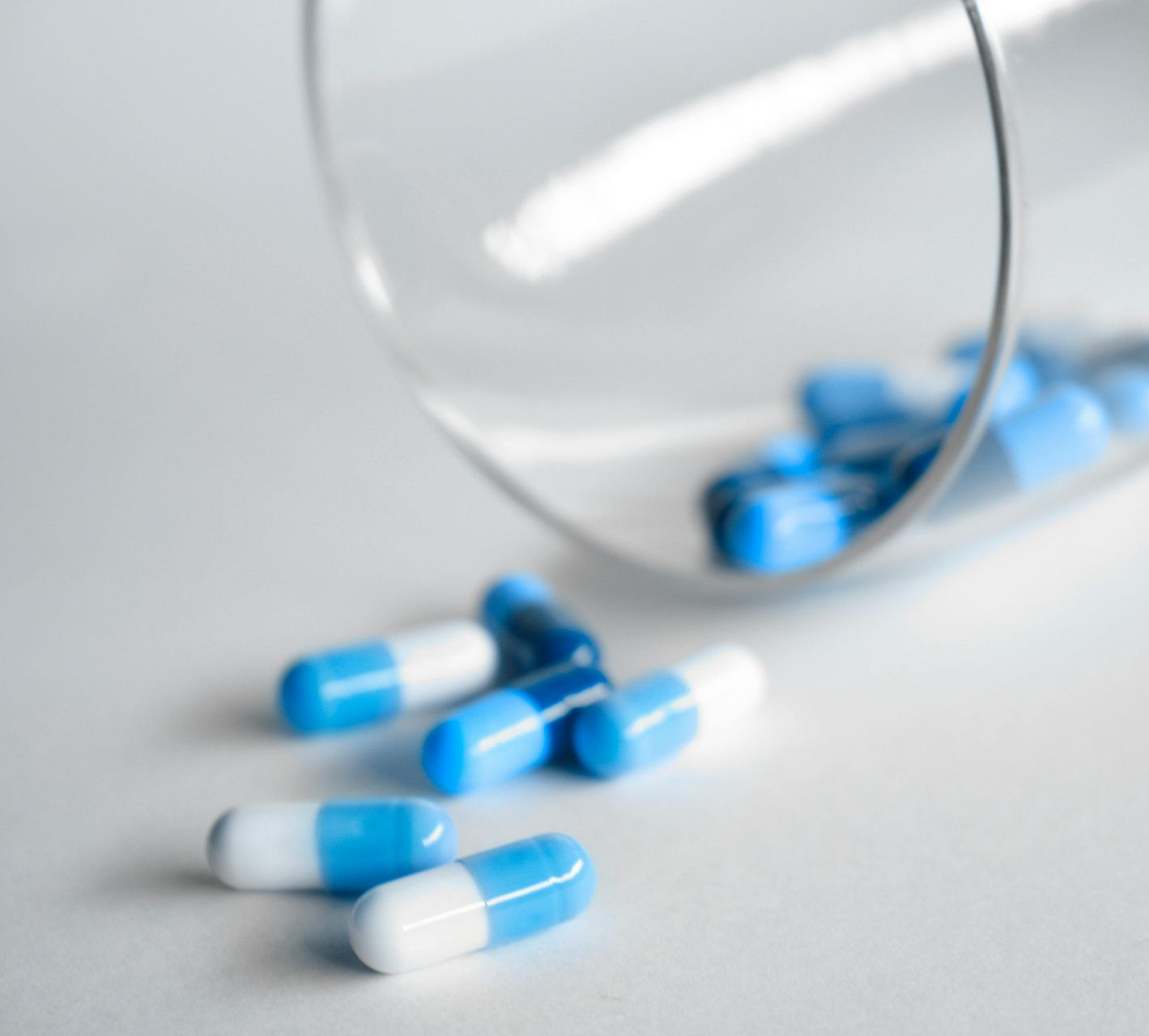 A pile of pills with one that says caf on it