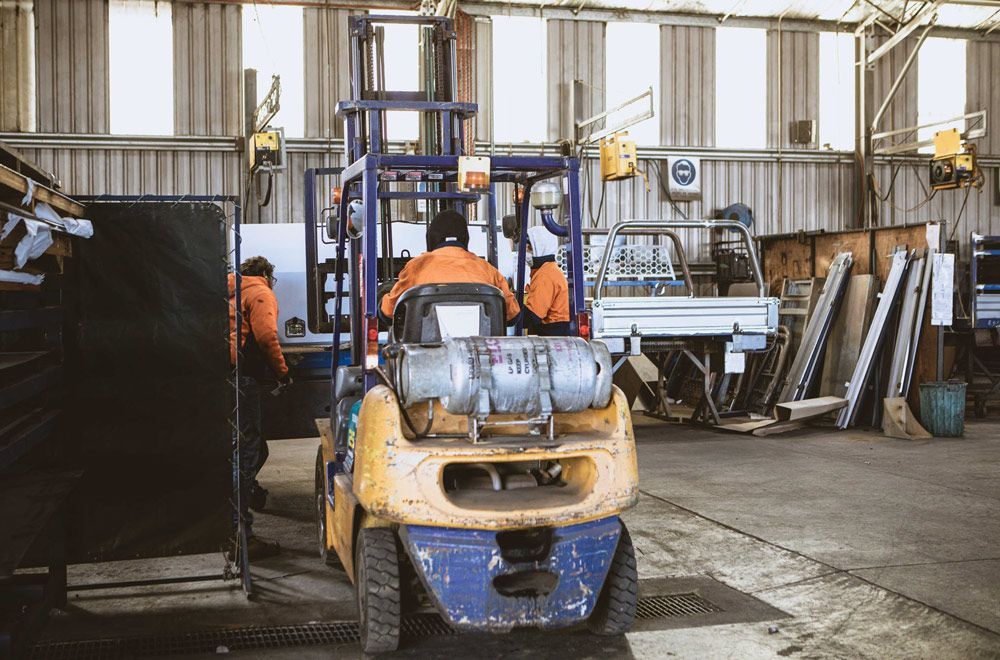 Men Working Inside Warehouse — Welding Works in Condobolin, NSW