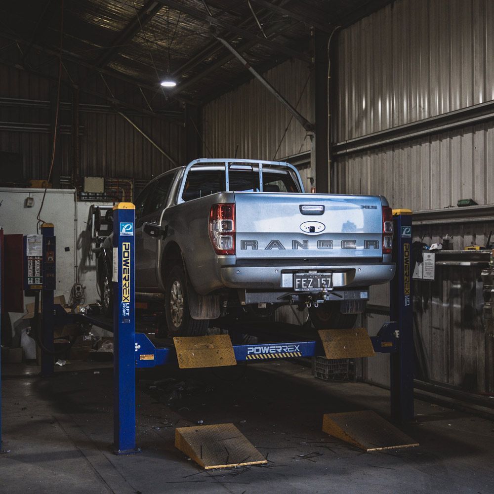 Ford Ranger On A Car Lift — Welding Works in Parkes, NSW