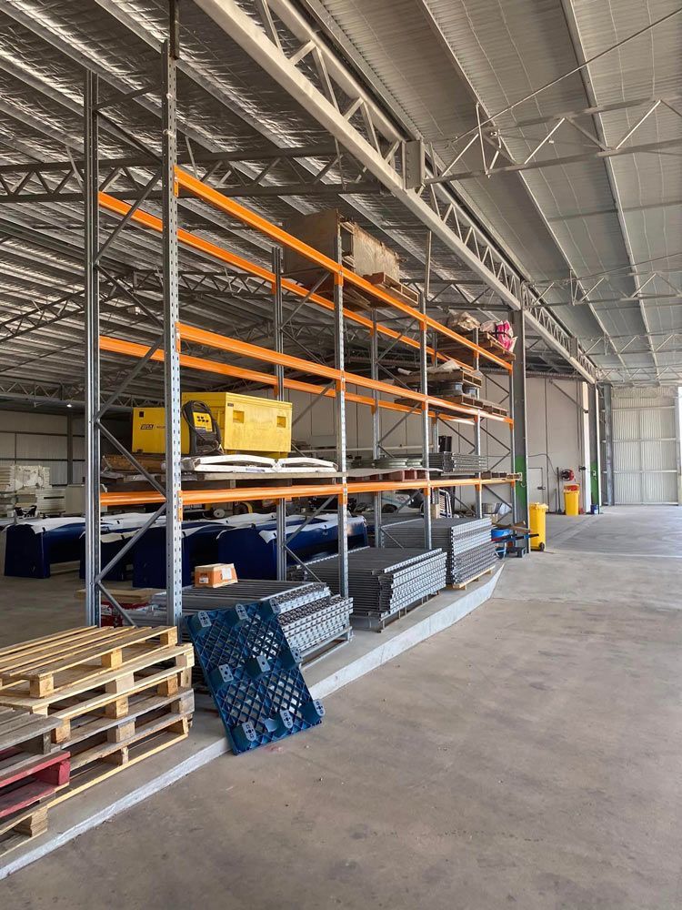 Warehouse With Steel Bars And Trays — Welding Works in Orange, NSW