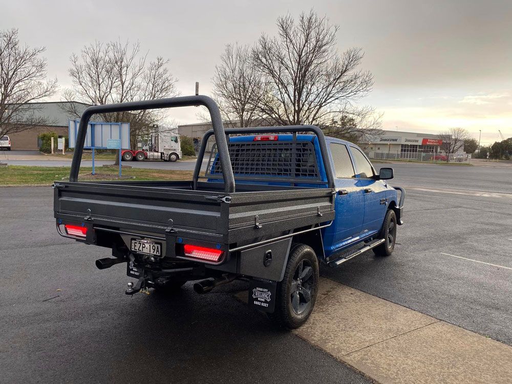 Blue Toyota Hi-Lux With Black Steel Tray And Rack — Welding Works in Dubbo, NSW