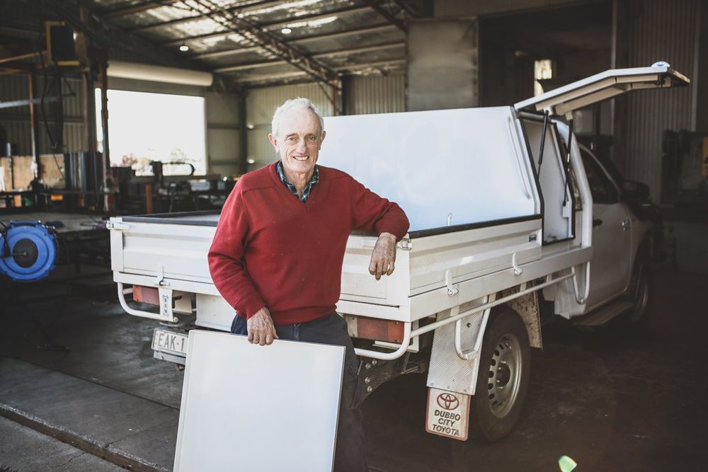 Satisfied Client With Custom-Designed Steel Ute Tray — Welding Works in Bathurst, NSW