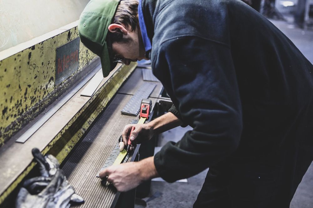 Measuring Steel Bars Using Measuring Tape — Welding Works in Orange, NSW