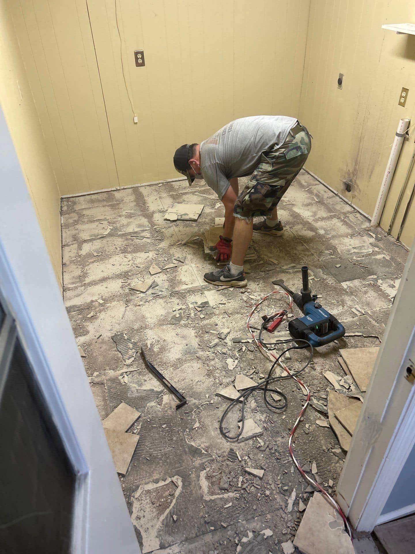 Man Working on the Floor with Drill – Columbus, GA – All Veteran Renovators