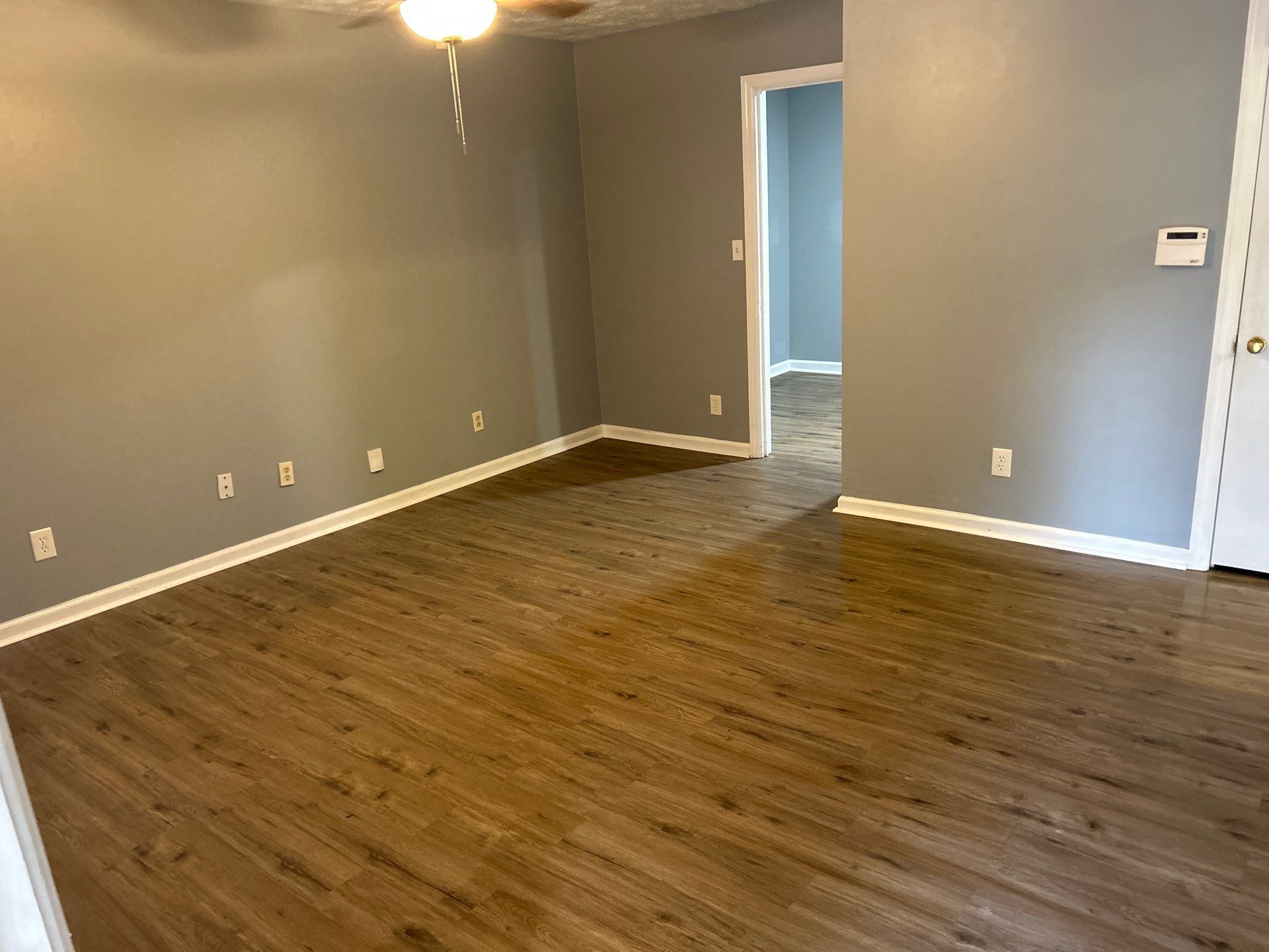 Living Room with Hardwood Floor and Ceiling Fan – Columbus, GA – All Veteran Renovators