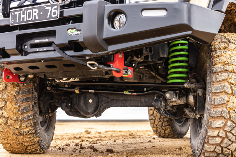 A close up of the underside of a truck with a license plate that says thor 76.