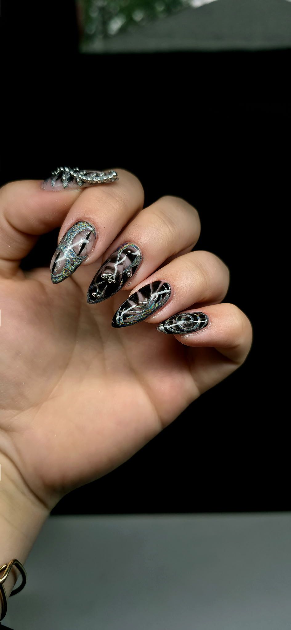 A close up of a person 's hand with long nails