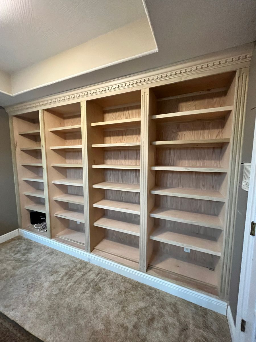 There are a lot of shelves in this room.