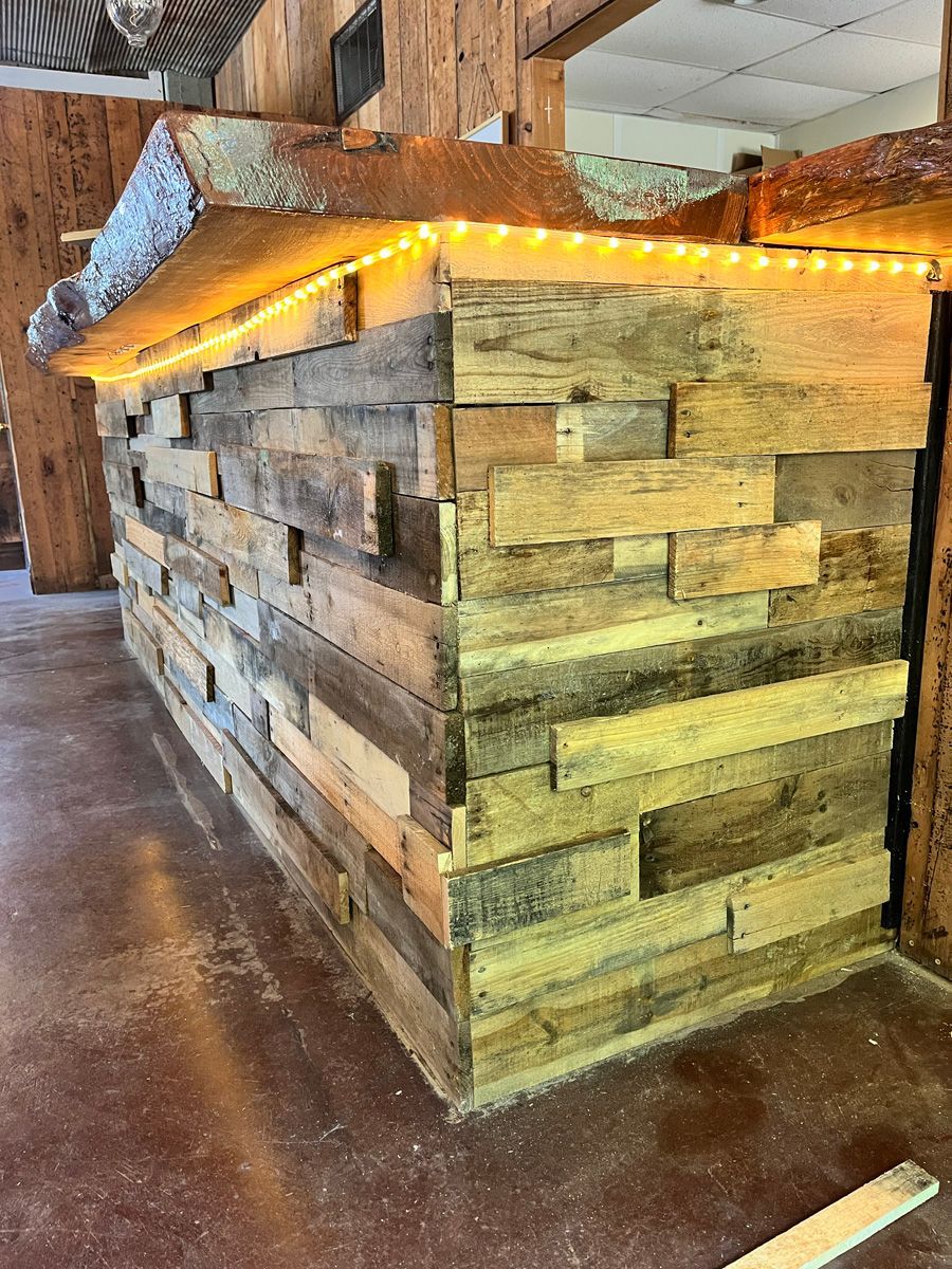 A wooden wall with lights on it in a room.