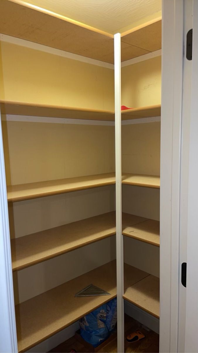 There are a lot of shelves in this closet.
