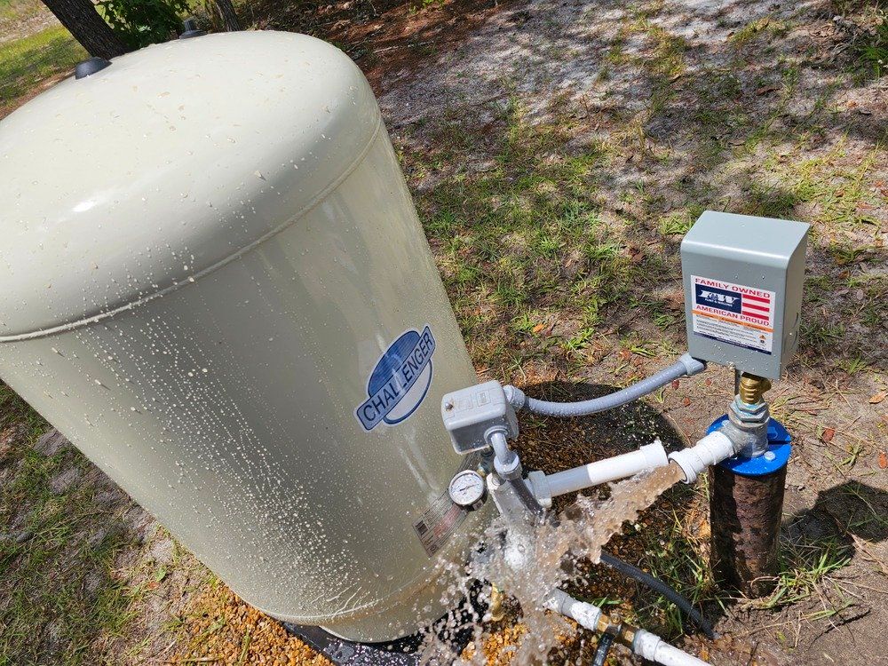 A water pump is being turned on and water is coming out of it.