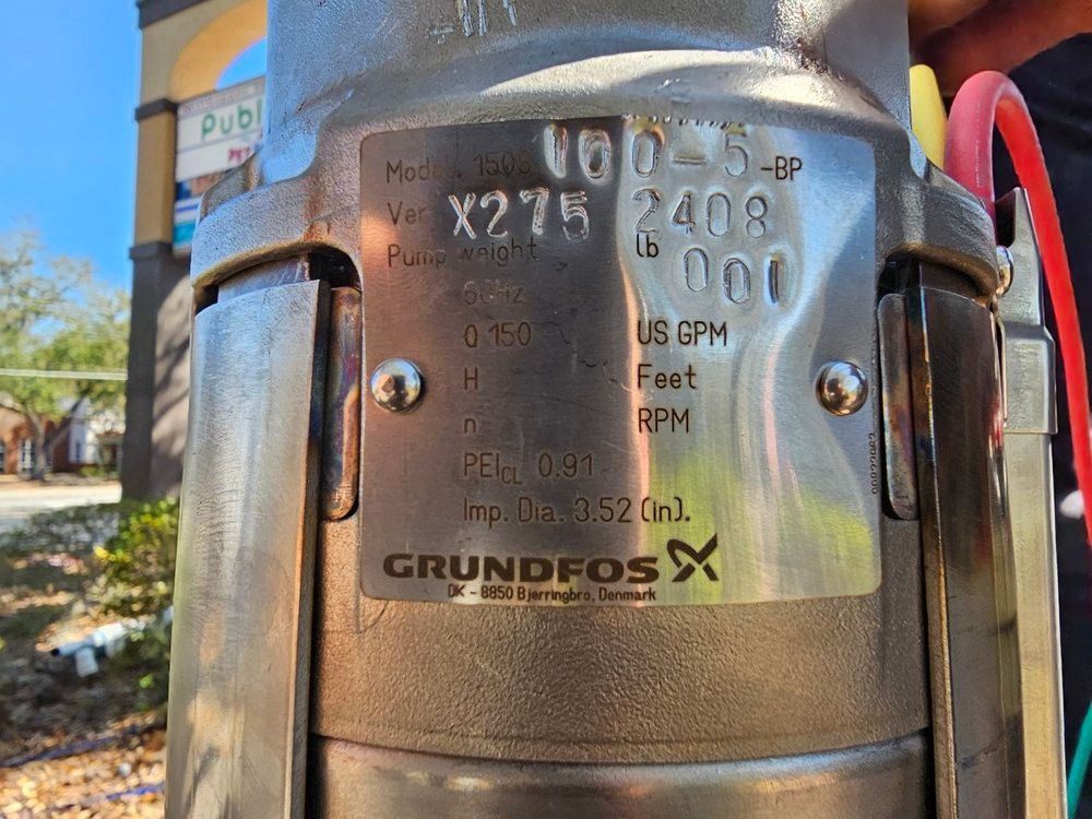 A person is holding a grundfos pump in their hand