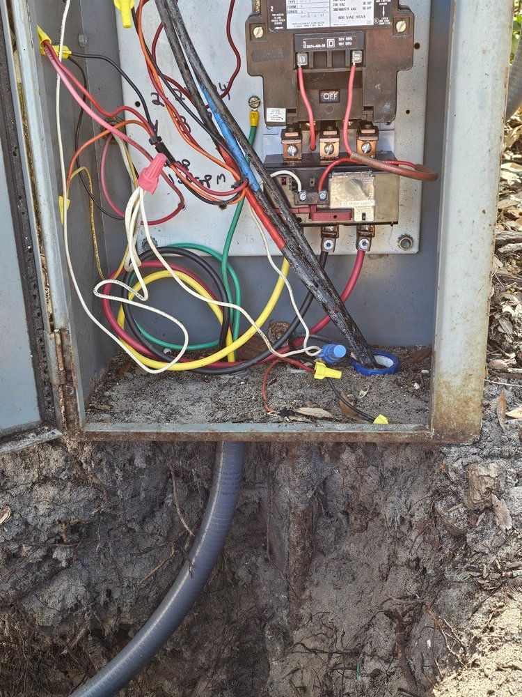 A electrical box with a lot of wires coming out of it