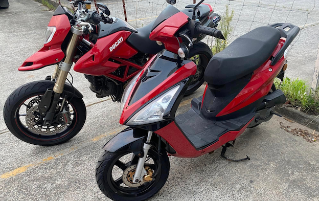 Red Scooter & Motorbike parked next to each other — Queensland Roadworthy Services In Southport, QLD