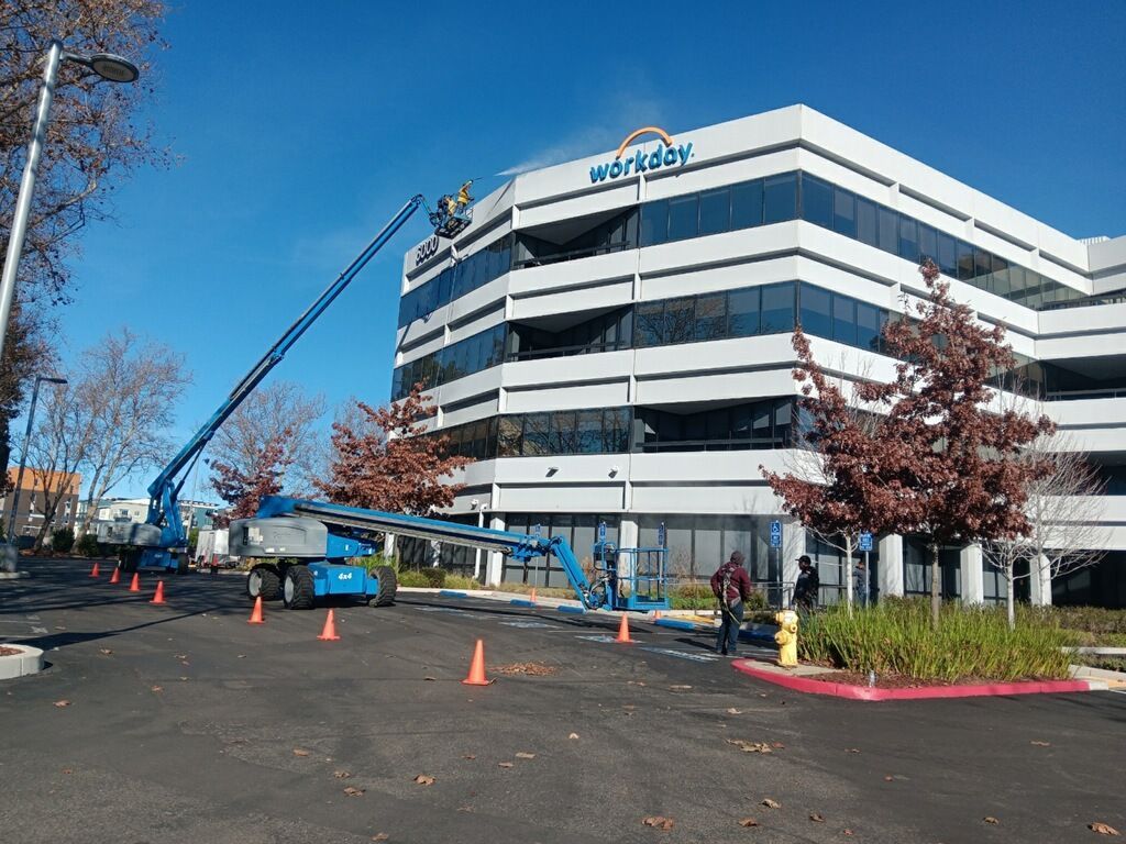 Blue lift reaching building with 